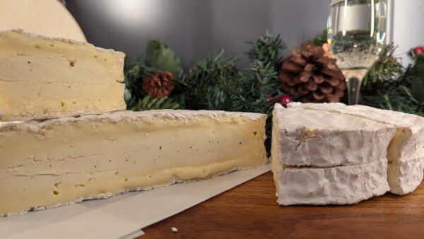 A wheel of truffled baron cut in half