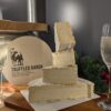 Truffled baron segments stacked and 2 glasses of champagne