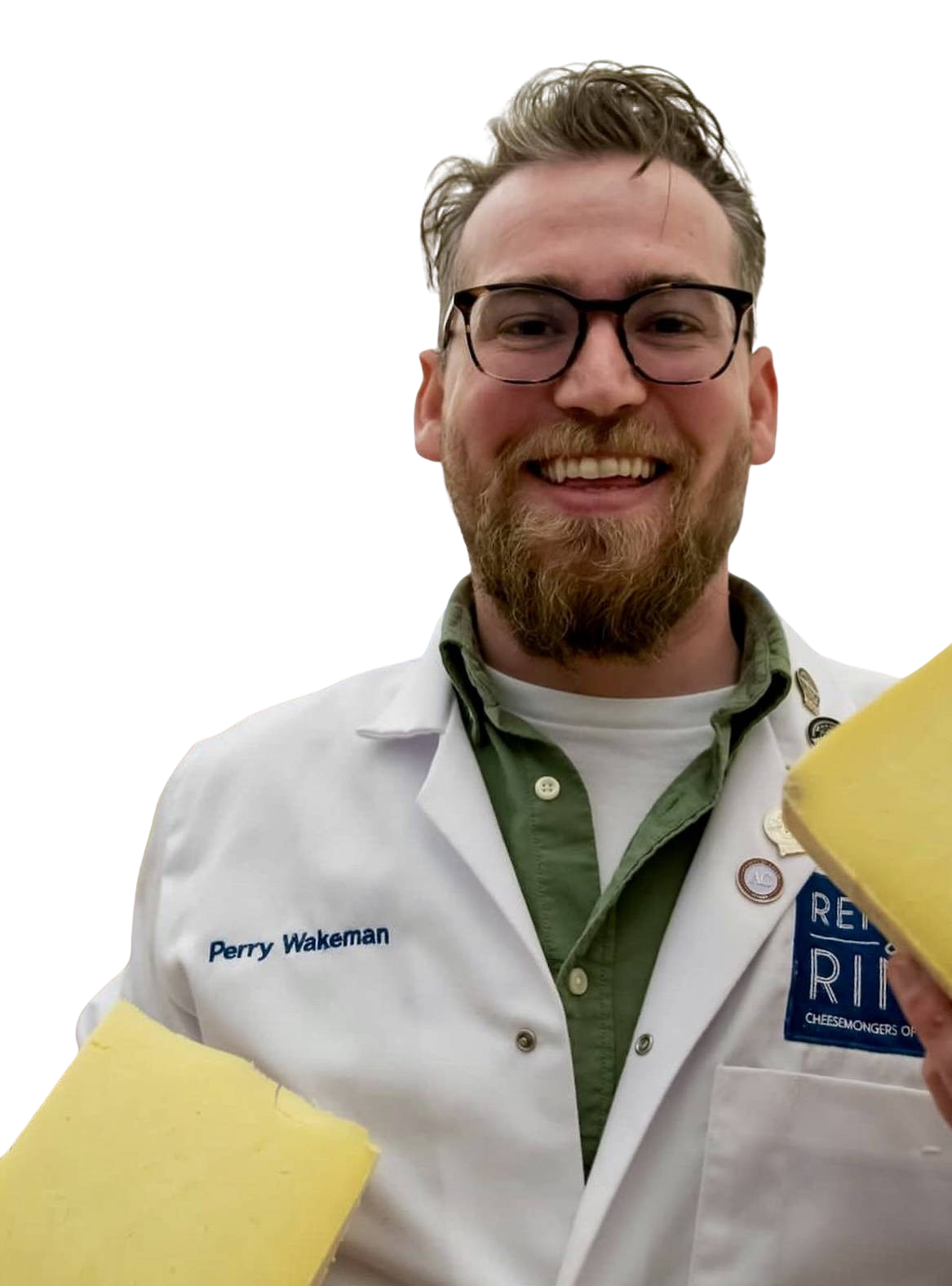 Affineur Perry Wakeman, smiling and holding cheese